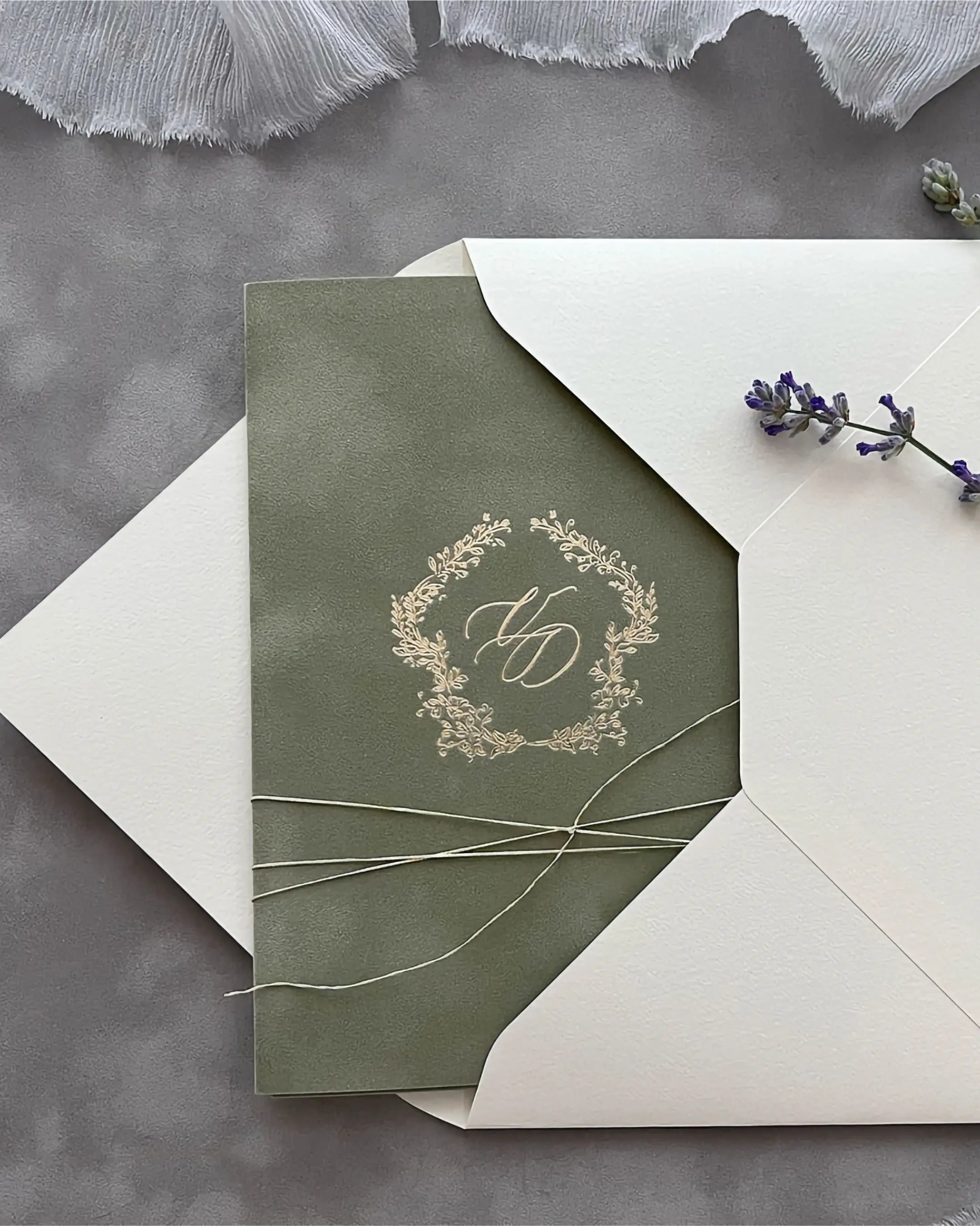 Virginie Sage Green velvet pocketfold wedding invitation with gold foil monogram and cream envelope — Polina Perri